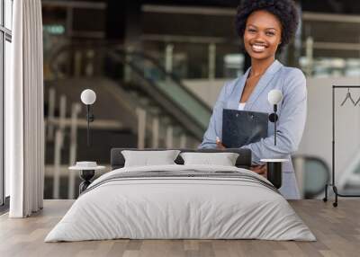 Female African American job seeker keeping a folder with CV Wall mural