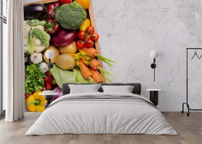 Fresh organic vegetables in wooden box on gray Wall mural