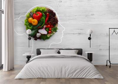 Fresh vegetables in woman head symbolizing health nutrition Wall mural