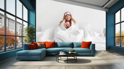 Fun morning in comfortable bed, happy woman enjoy weekend, vacation and free time Wall mural