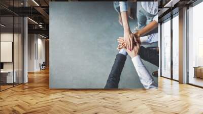 Group Of Business People Holding Hands In Office, Cropped, Top-View Wall mural