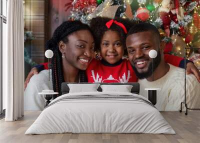 Happy african american family of three spending Christmas holidays together Wall mural