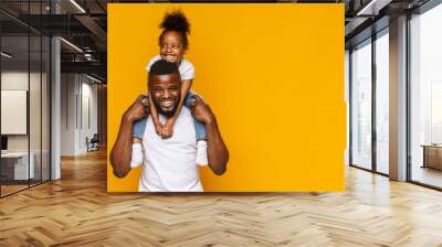 Happy african american father and daughter having fun Wall mural