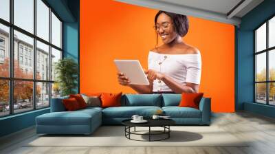 Happy African American Woman Using Digital Tablet Standing, Studio Shot Wall mural