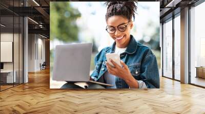 Happy African American Woman With Cellphone Texting Working Outside Wall mural