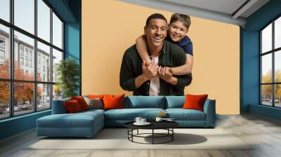 Happy black man have fun with cute child preteen boy Wall mural