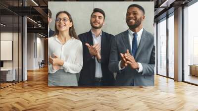 Happy business team applauding after successful meeting Wall mural