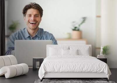 Happy Employee Smiling At Camera While Working On Laptop In Office Wall mural