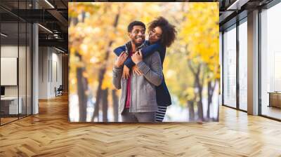 Happy lovely couple spending time at fall park Wall mural