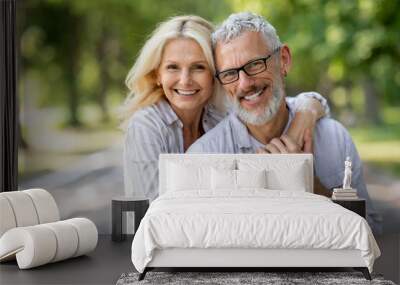 Happy Mature Spouses. Portrait of older couple hugging and smiling at camera Wall mural