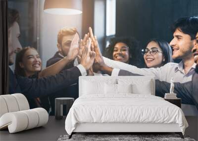 happy office workers giving high five at meeting Wall mural