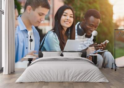 Happy Teens International Students Studying Together Outdoors, Enjoying University Life Wall mural