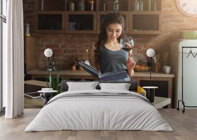 Happy woman preparing healthy food in kitchen Wall mural