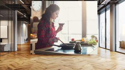 Happy woman preparing healthy food in kitchen Wall mural