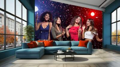 Happy women celebrating New Year at nightclub Wall mural