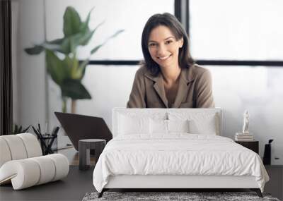 Happy young manager smiling at camera in office Wall mural