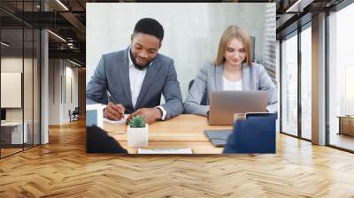 Hr managers interviewing job applicants, making notes Wall mural