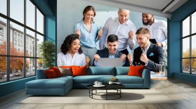 Joyful Coworkers At Laptop Celebrating Successful Deal Sitting In Office Wall mural