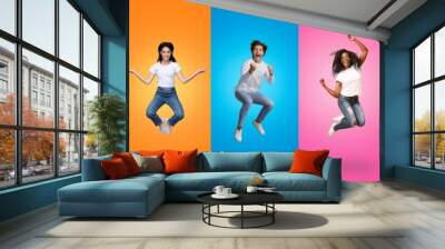 Joyful multiracial people jumping up on colorful backgrounds, collage set Wall mural