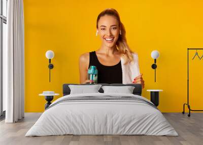 Lady Listening To Music Holding Water And Towel, Yellow Background Wall mural