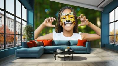 Little black girl with tiger face painting Wall mural