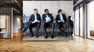 Men Staring At Woman Applicant Waiting For Job Interview Indoors Wall mural