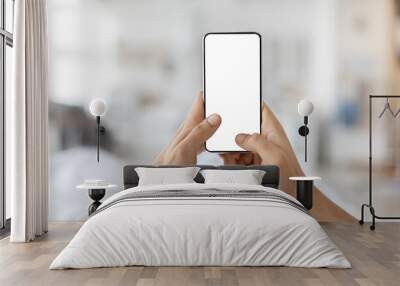 Mobile Mockup. Unrecognizable Male Holding Blank Smartphone While Relaxing In Bed Wall mural