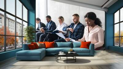 Multiracial Business People Waiting For Job Interview Sitting Indoors Wall mural