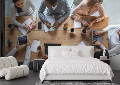 Multiracial business team having meeting, top view Wall mural