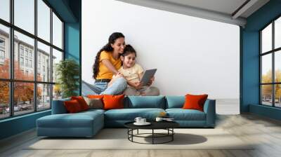 Online Offer. Smiling Arab Mother And Little Daughter Using Digital Tablet Together Wall mural