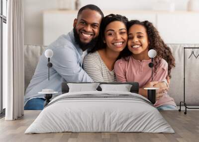 Portrait of a happy black family smiling at home Wall mural