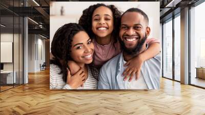 Portrait of a happy black family smiling at home Wall mural