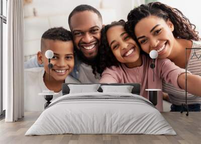 Portrait of african american family taking a selfie together at home Wall mural