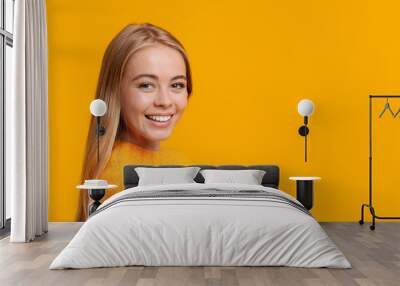 Portrait of beautiful young girl smiling to camera Wall mural