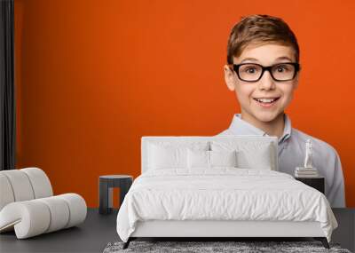 Portrait of cute school boy in glasses Wall mural