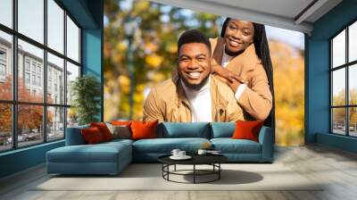 Portrait of happy african american couple posing outdoors Wall mural