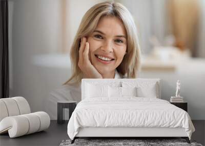 Portrait of smiling beautiful woman with smooth face skin Wall mural