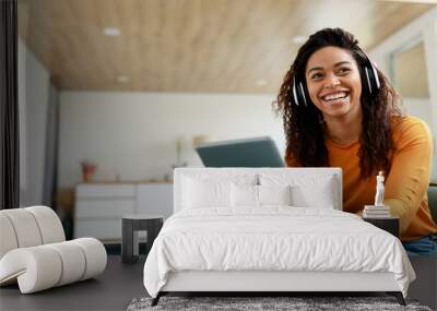 Portrait of smiling black woman using tablet at home Wall mural