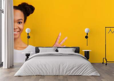 Positive Emotions. Close-up portrait of happy black teen girl showing peace, victory or two sign Wall mural