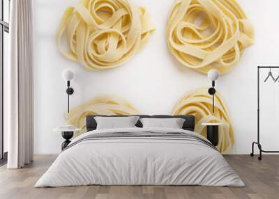 Raw tagliatelle nest isolated on white Wall mural