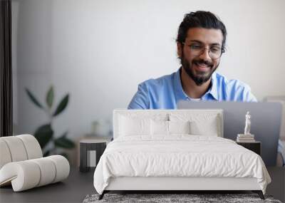 Recruitment Concept. Smiling Western Guy Using Laptop, Searching Jobs Online In Internet Wall mural