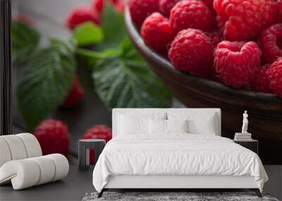 Red fresh raspberries on brown rustic wood background Wall mural