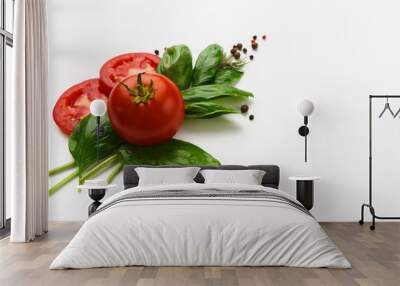 Red tomatoes and basil leaves isolated on white Wall mural