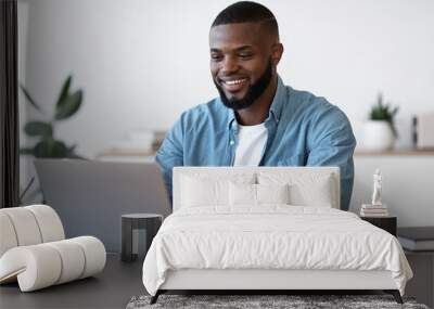 Remote Work. Handsome Black Freelancer Guy Working On Laptop At Home Office Wall mural