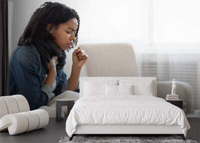 Risk Of Coronavirus. Sick Black Woman Coughing Hard At Home Wall mural