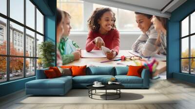 School Children Having Fun Using Smartphone During Break In Classroom Wall mural