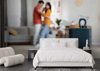 Selective focus on portable speaker over dancing couple Wall mural