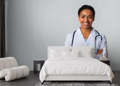 Smiling Black Female Doctor In White Coat Posing With Folded Arms Wall mural