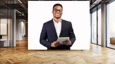 Smiling black guy standing with tablet at studio Wall mural