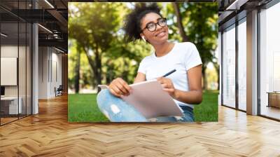 Smiling Black Studet Girl Sketching Learning Sitting In Park Outside Wall mural